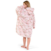 Person wearing a hooded blanket on a white background