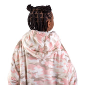 A child with a sherpa wearable blanket on
