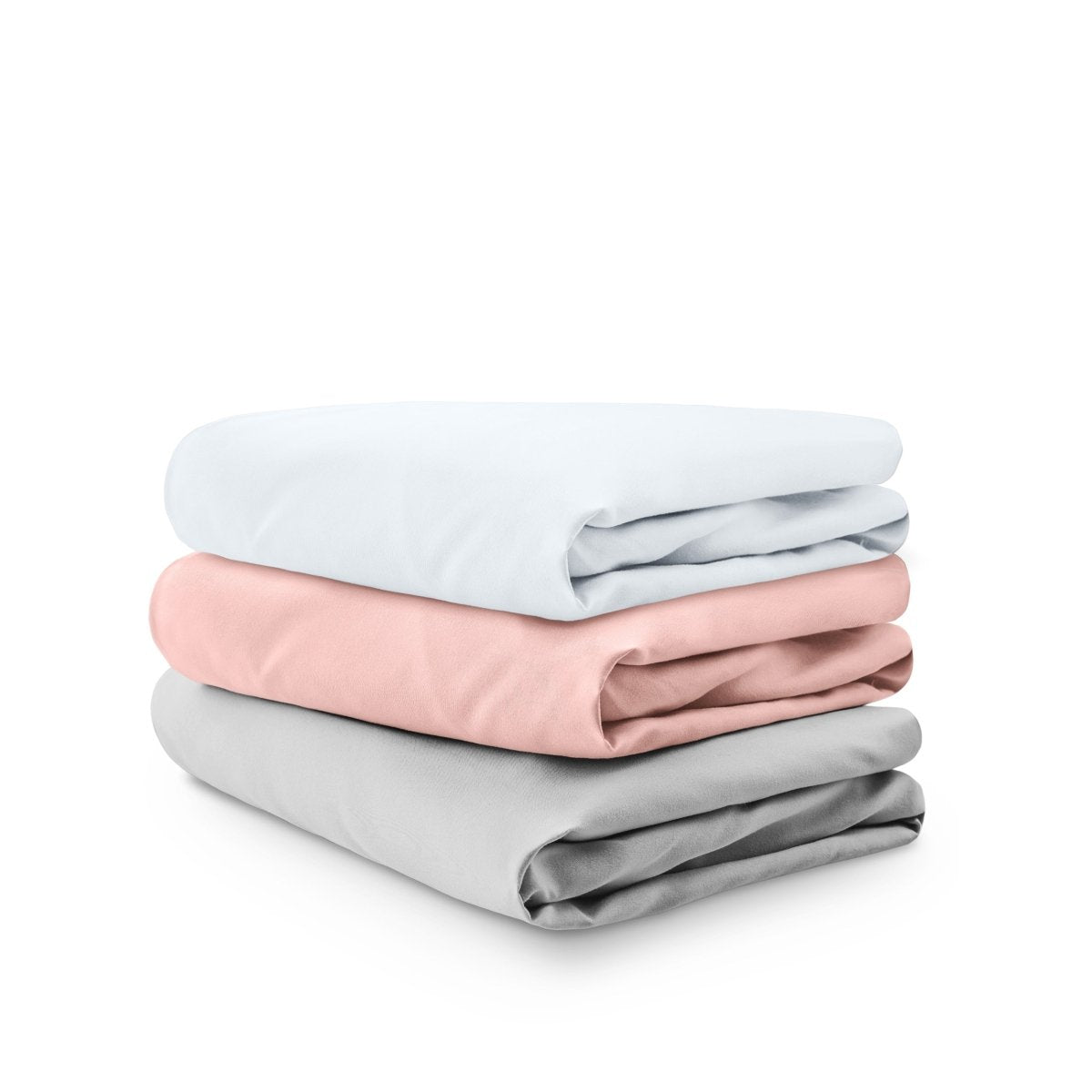 Stack of folded crib sheets on a white background