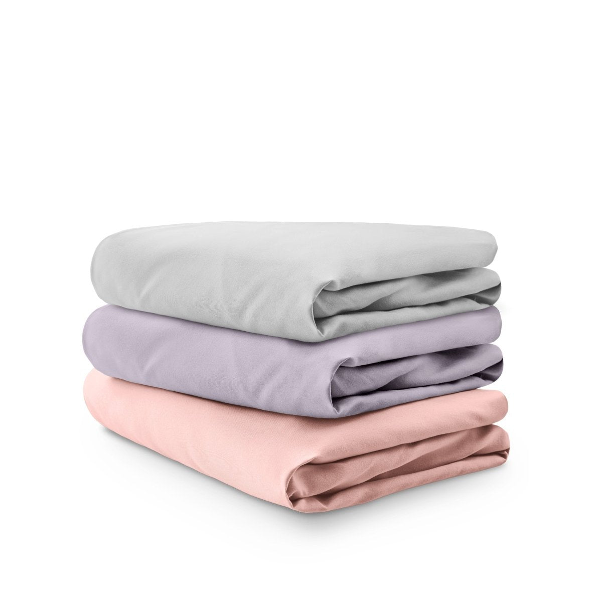 Stack of folded crib sheets on a white background