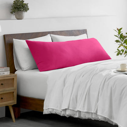 Bed with microfiber bedding and wooden headboard in a bedroom setting