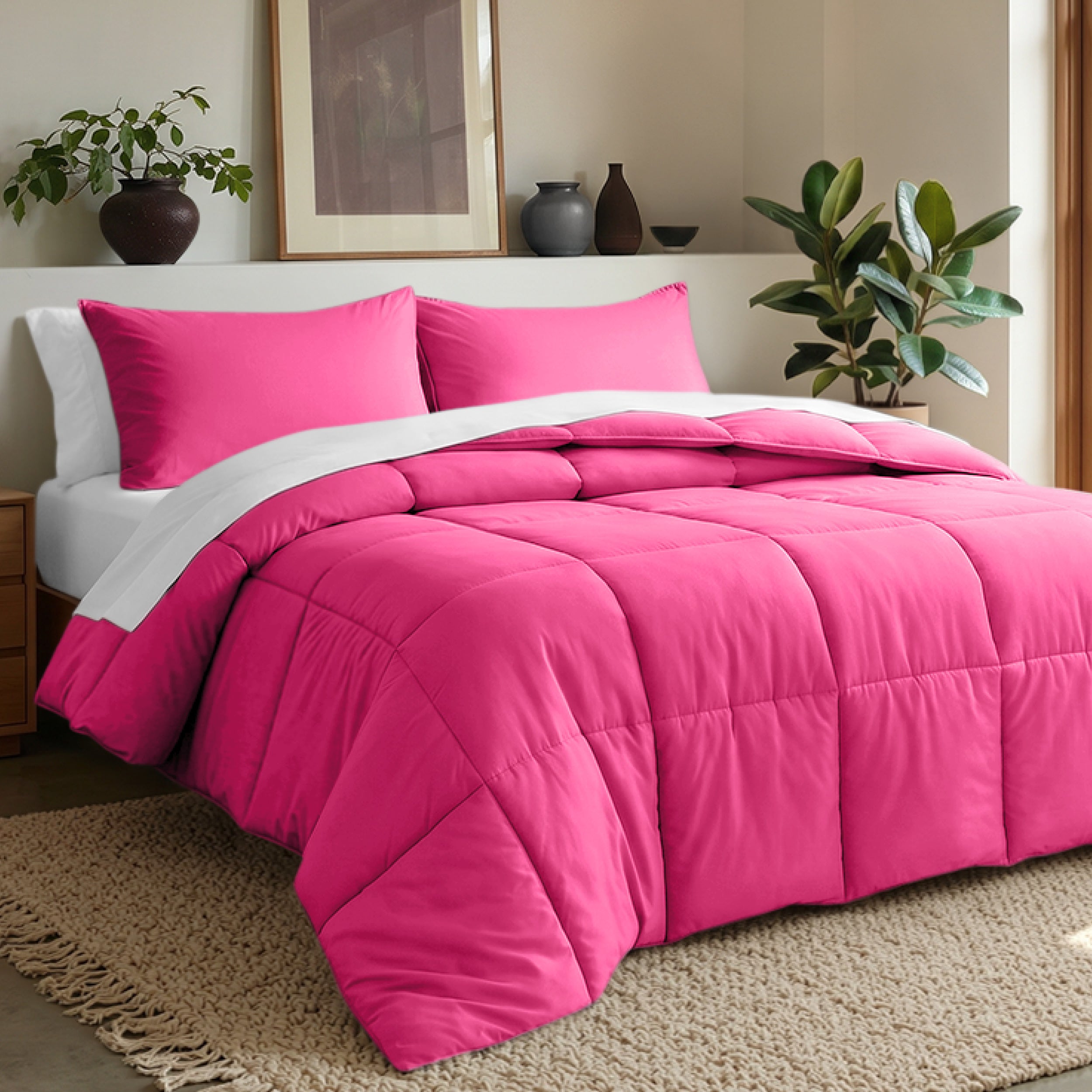 Comforter set on a bed in a bedroom with plants and decor.