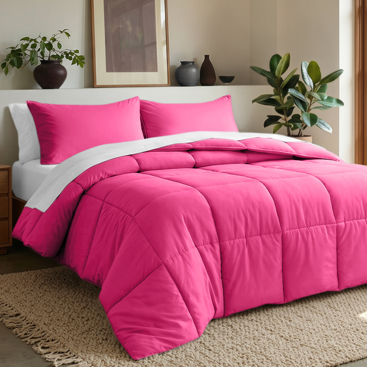 Comforter set on a bed in a bedroom with plants and decor.