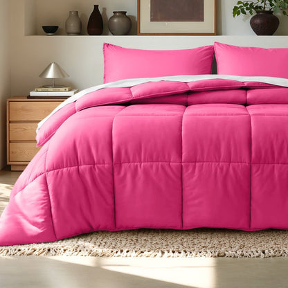 Comforter on a bed in a bedroom setting with a wooden nightstand and decorative items.