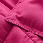 Close-up of comforter fabric with stitching detail
