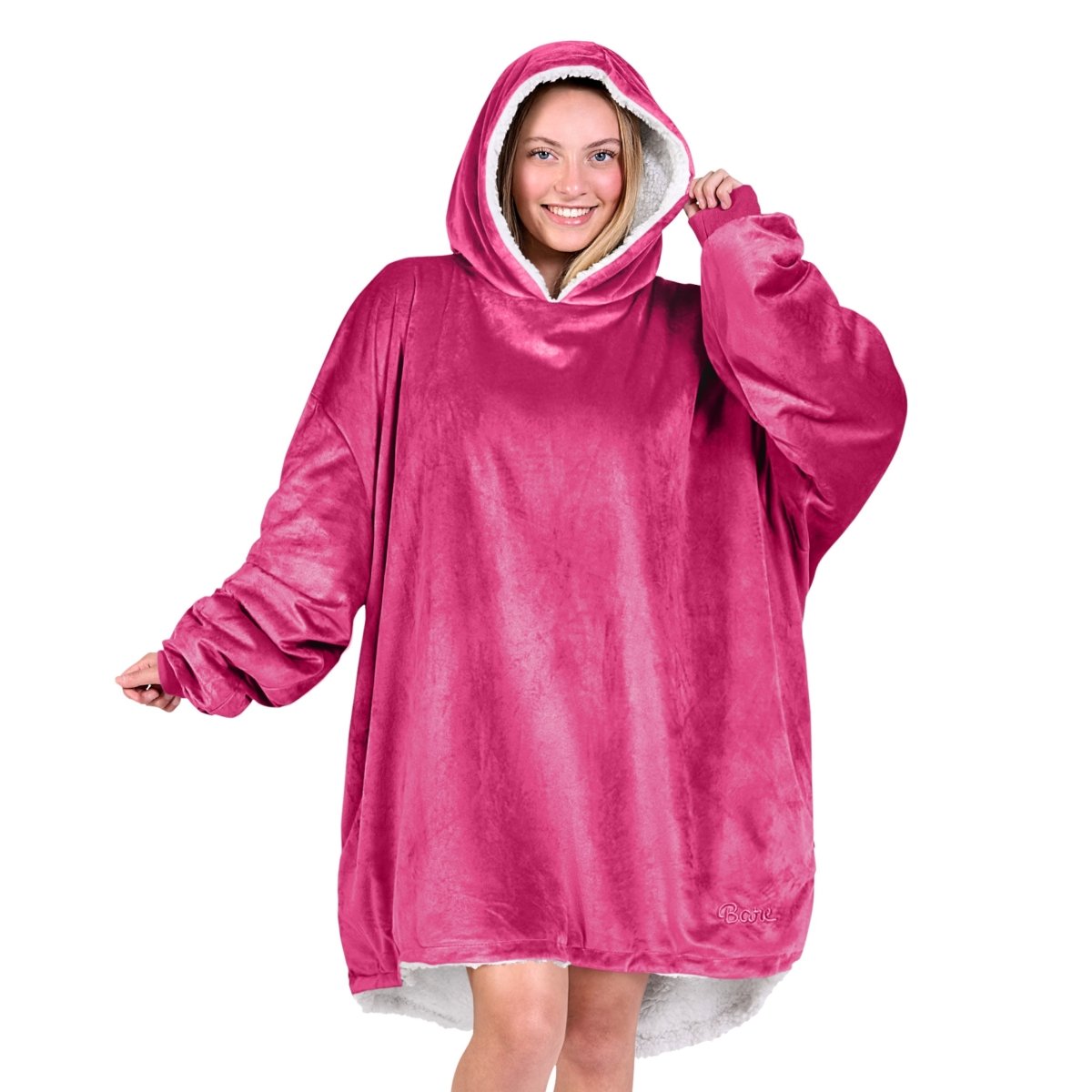An adult with a sherpa wearable blanket on