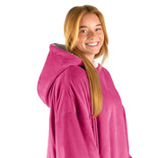 An adult with a hooded wearable blanket on
