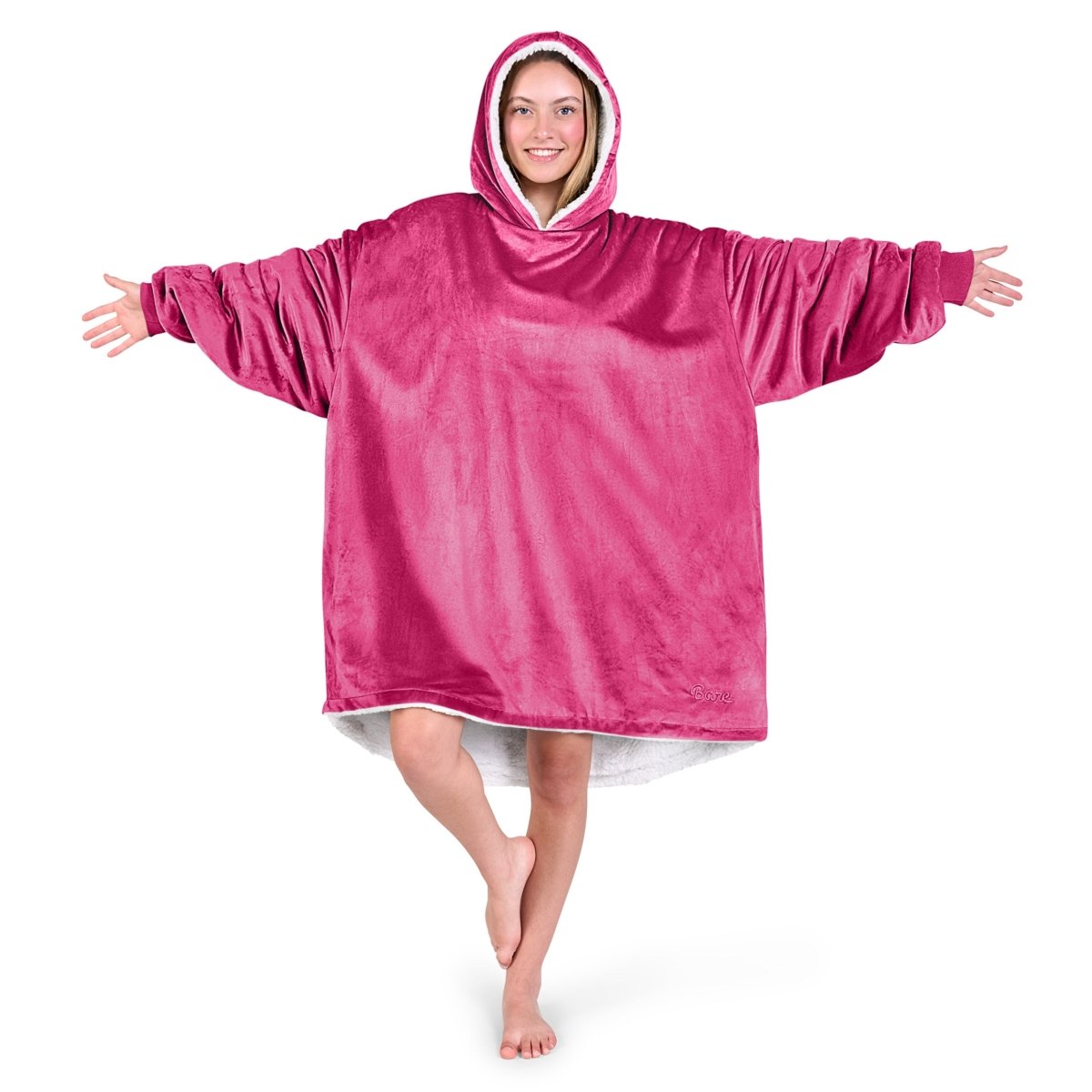 An adult with a sherpa wearable blanket on