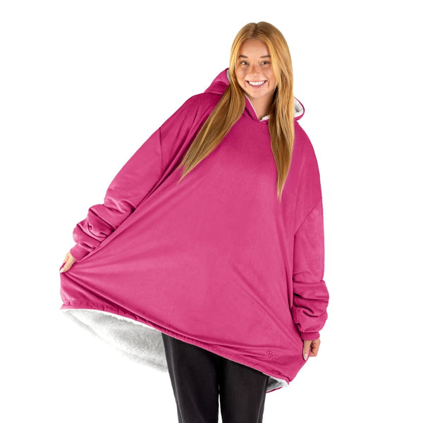An adult with a sherpa wearable blanket on