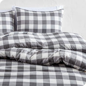 A modern bed with a printed microfiber duvet cover and sham set.