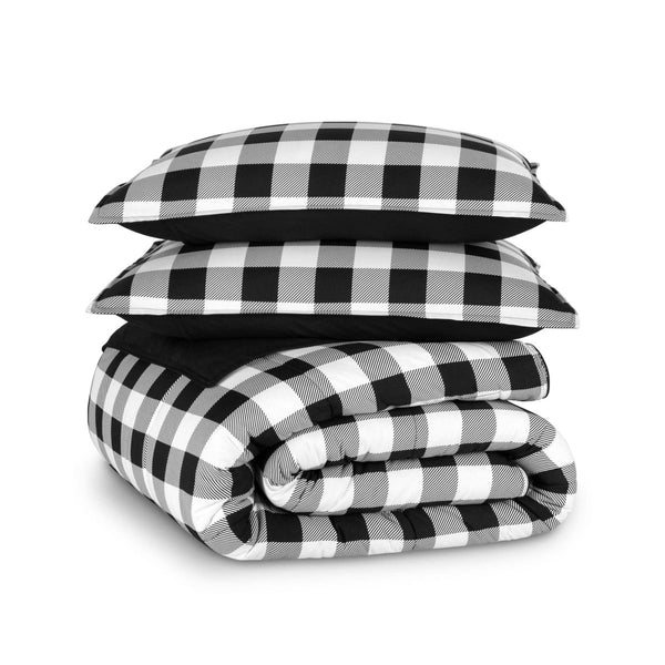 Black and white plaid comforter set folded and stacked