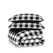 Checkered comforter and pillows on a white background
