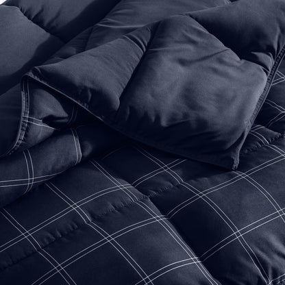 Navy blue checkered comforter on a bed