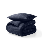 Comforter and pillow shams on a white background