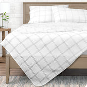 Printed flat sheet on a bed