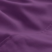 A close-up of microfiber fabric with soft folds and a visible stitched seam.