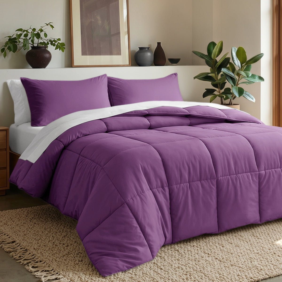 Comforter set on a bed in a bedroom with plants and decor.