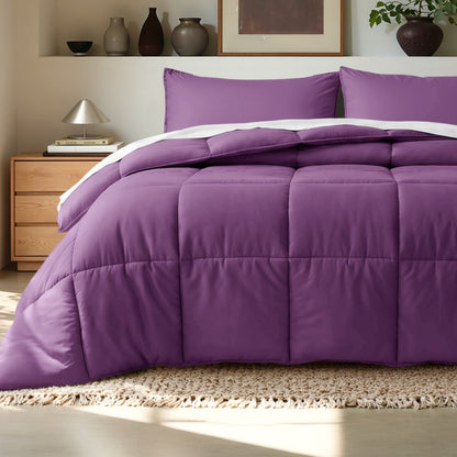 Comforter on a bed in a bedroom setting with a wooden nightstand and decorative items.