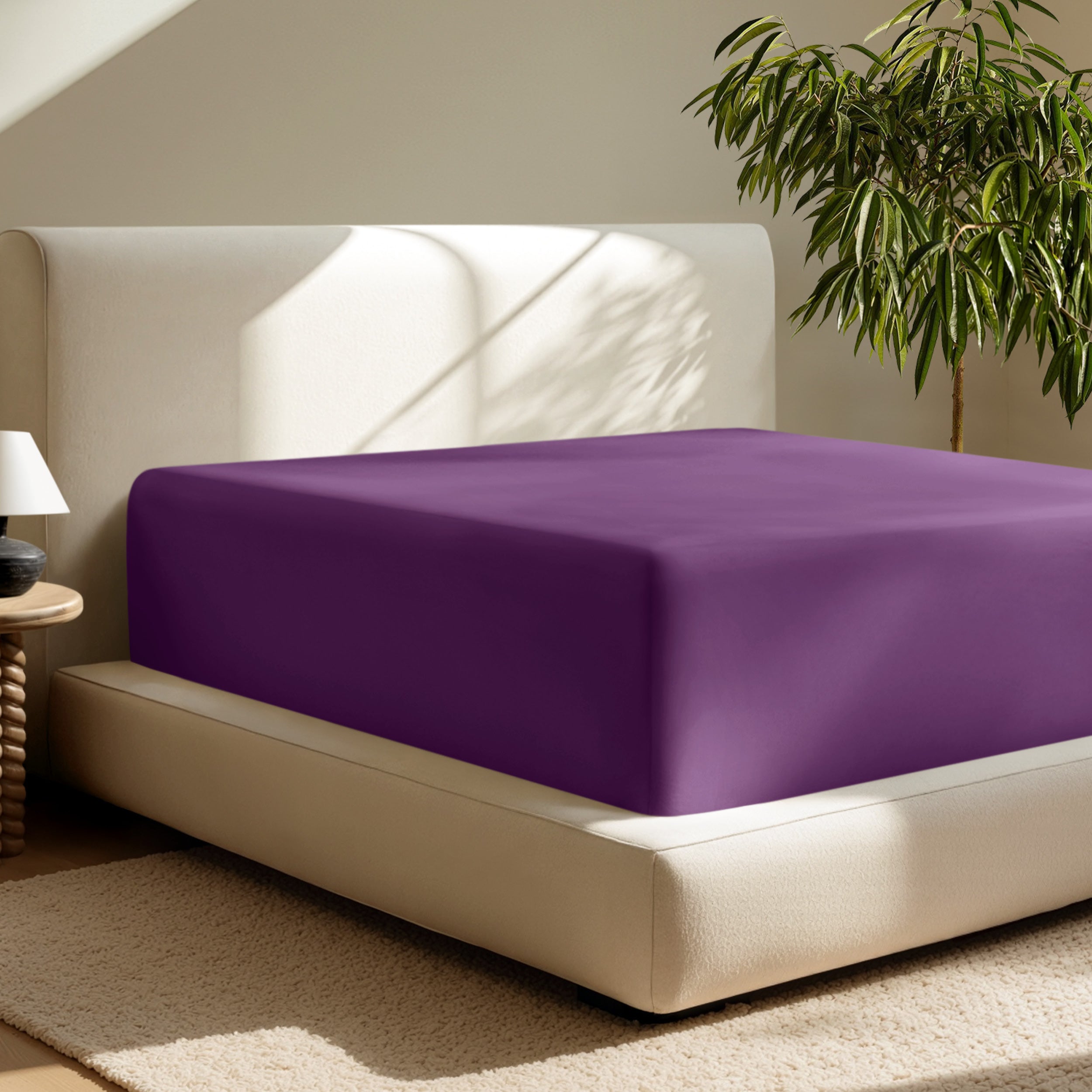 A deep pocket fitted sheet on a mattress