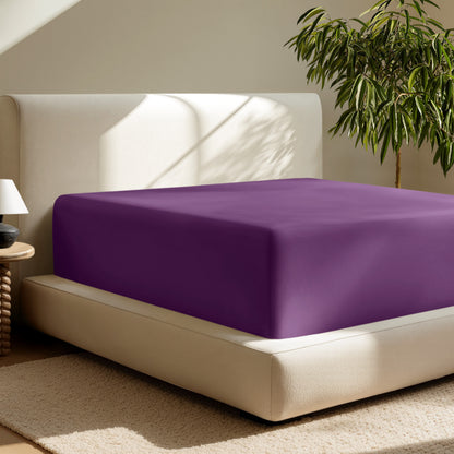 A deep pocket fitted sheet on a mattress