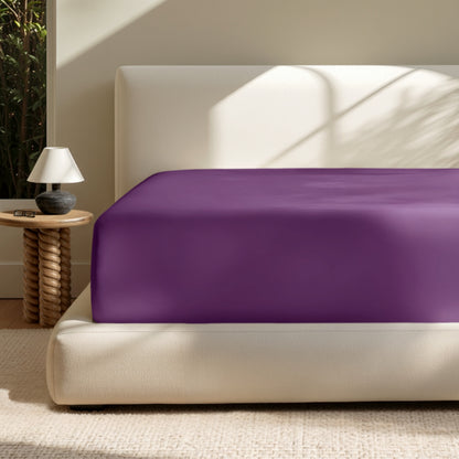 A deep pocket mattress with a fitted sheet on it