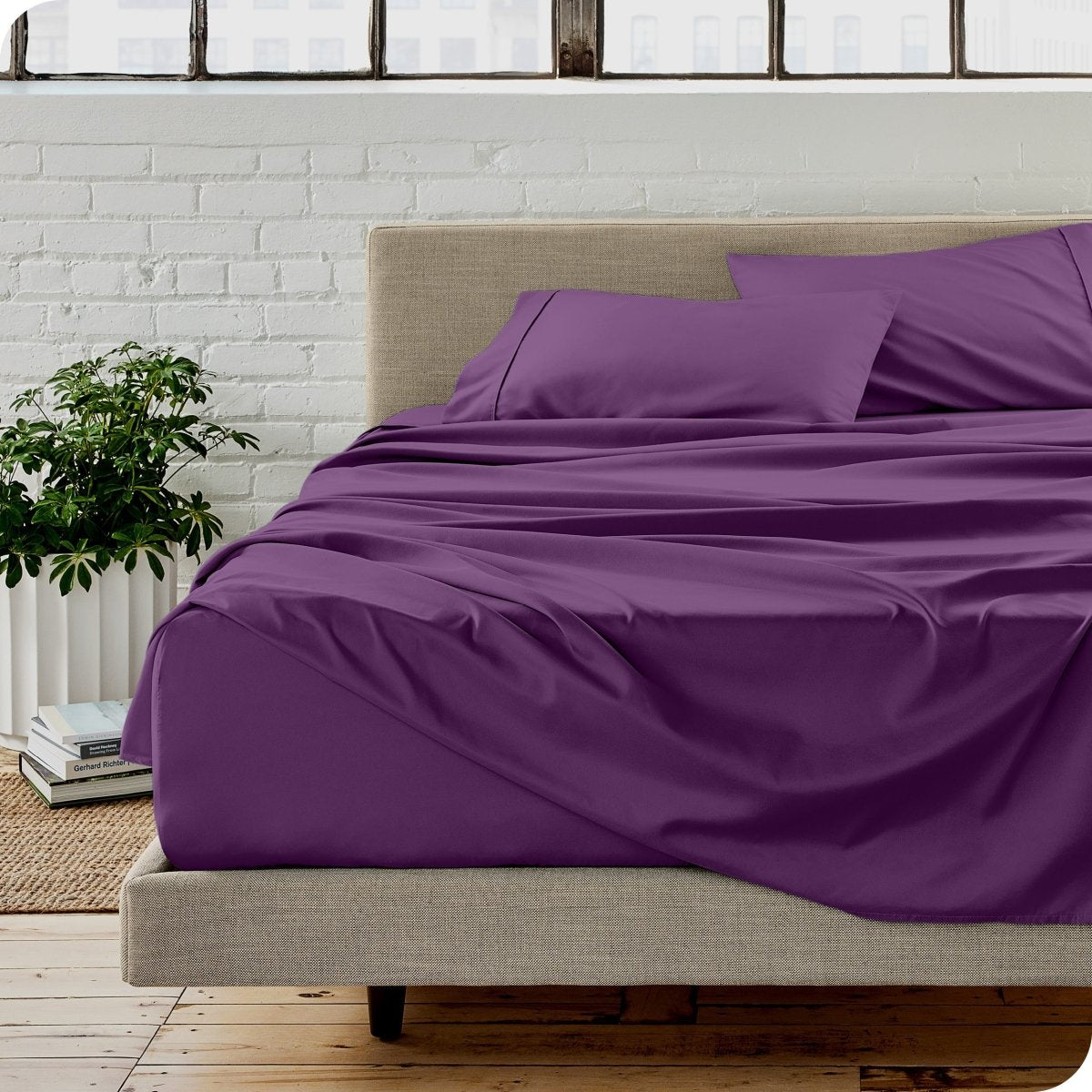 A modern bedroom with microfiber sheets on the mattress