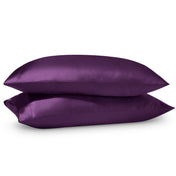 2 satin pillowcases on pillows stacked