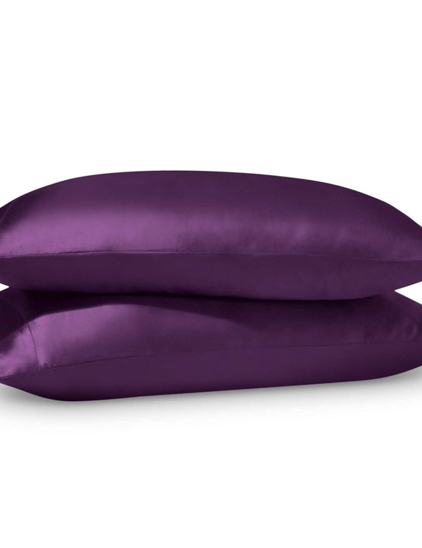 2 satin pillowcases on pillows stacked