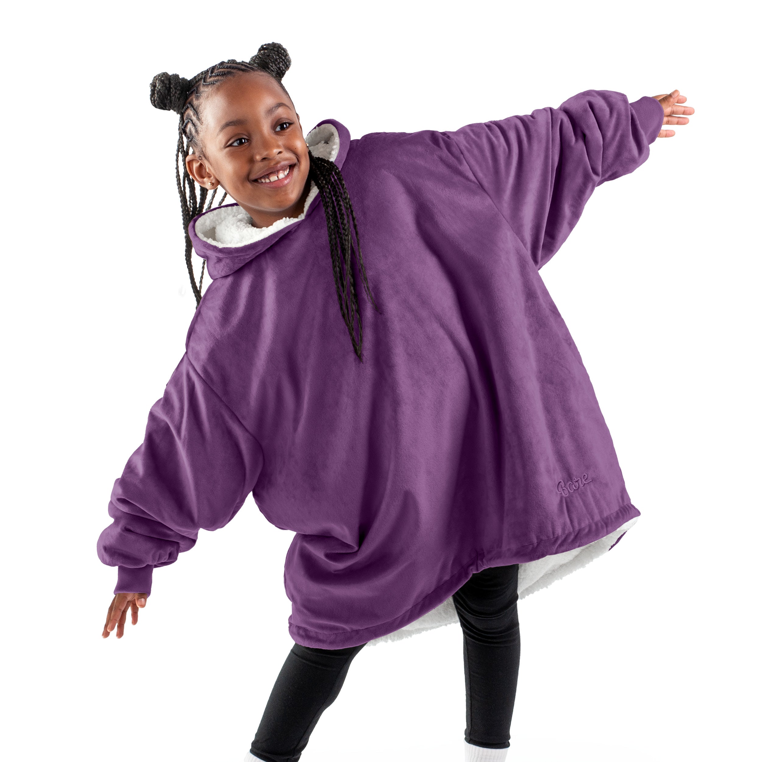A child with a wearable blanket on