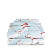 Stack of flannel sheets and pillowcases on a white background