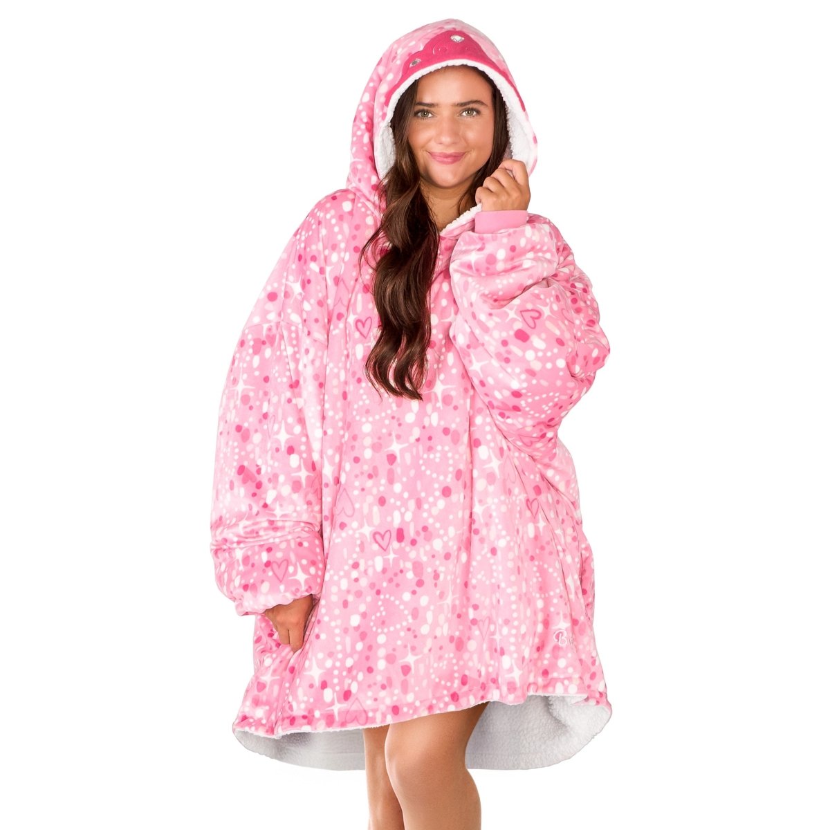 An adult with a sherpa wearable blanket on