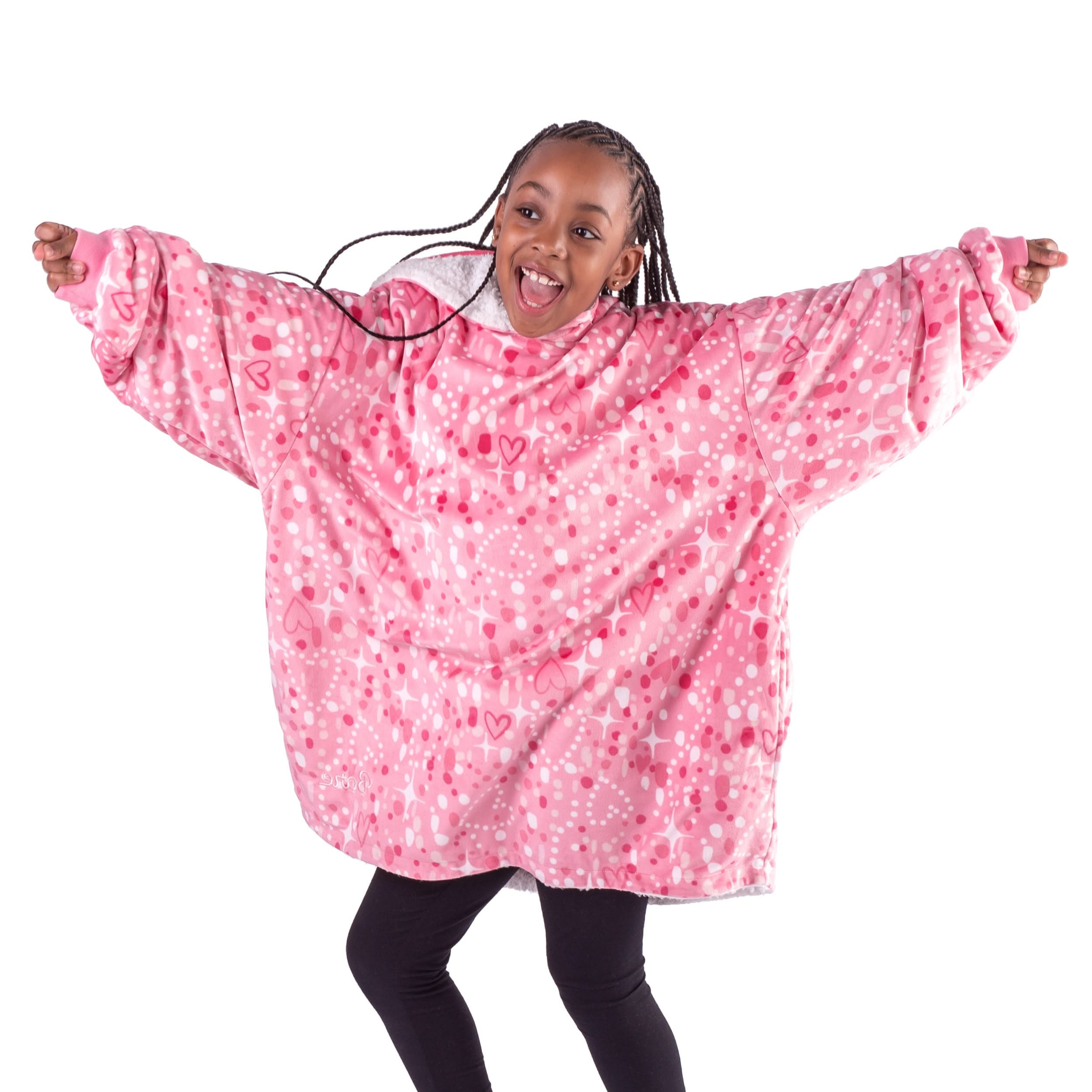 A girl is dancing while in a wearable blanket