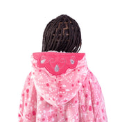 A child with a sherpa wearable blanket on