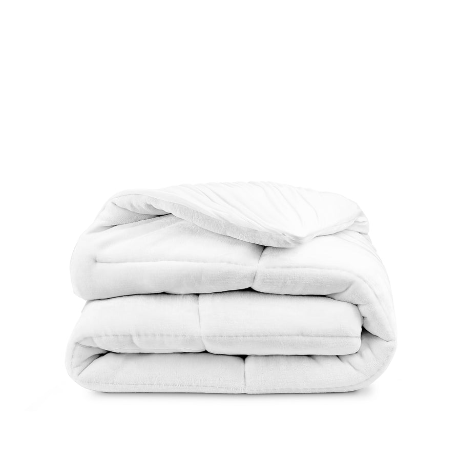 A reversible mattress pad folded