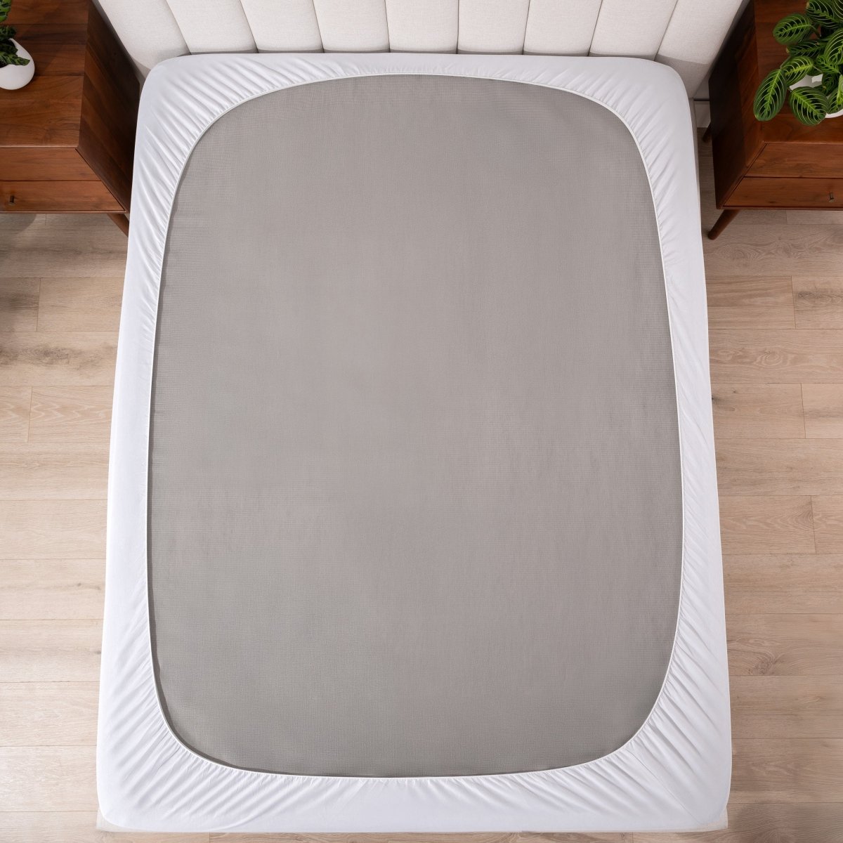 A reversible mattress pad on a mattress