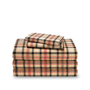 Stack of flannel sheets and pillowcases on a white background