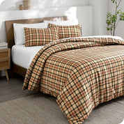 Red lodge plaid duvet cover set on a bed in a bright bedroom