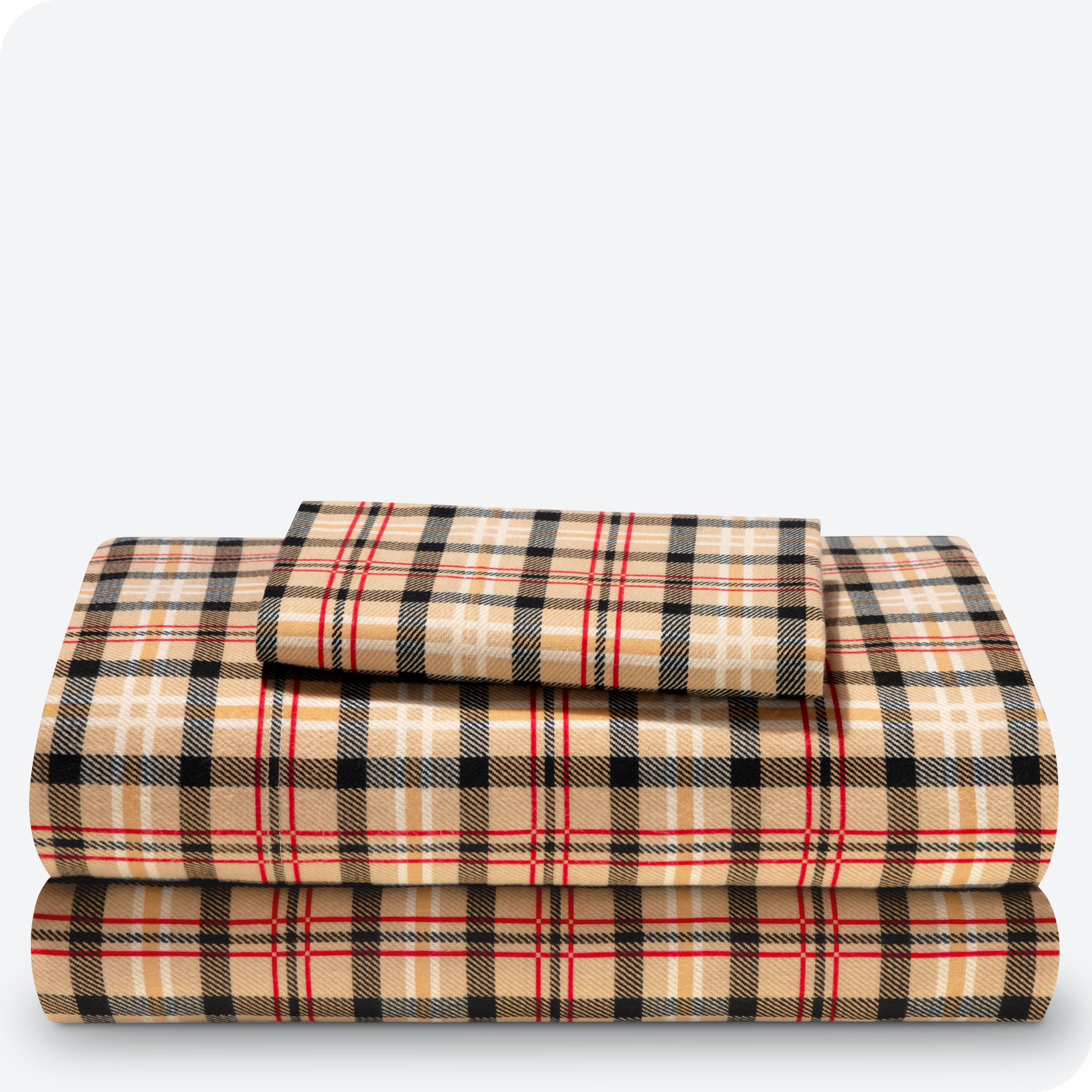 Flannel print sheet set folded and stacked neatly on a white background
