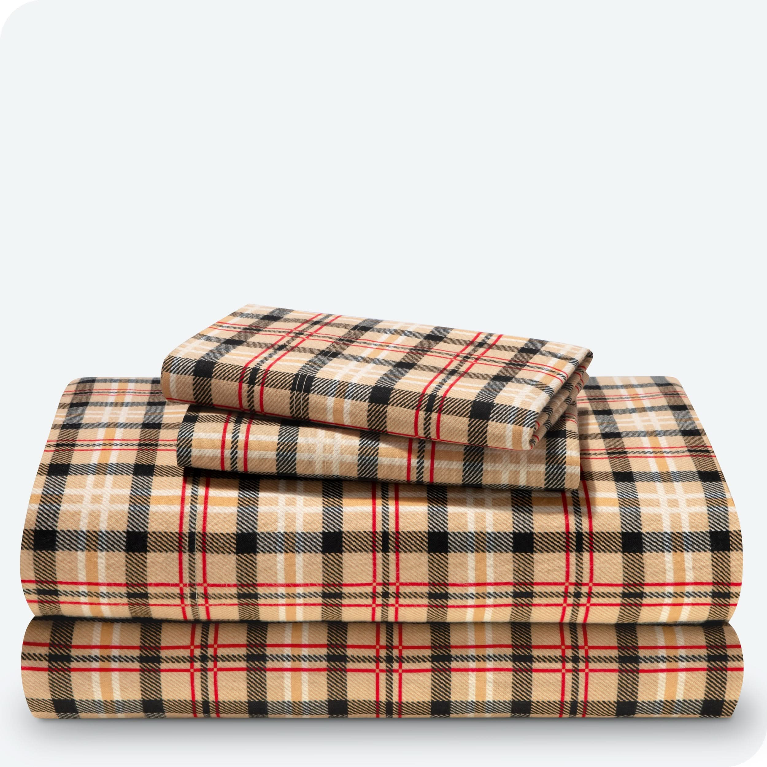 Flannel print sheet set folded and stacked neatly on a white background