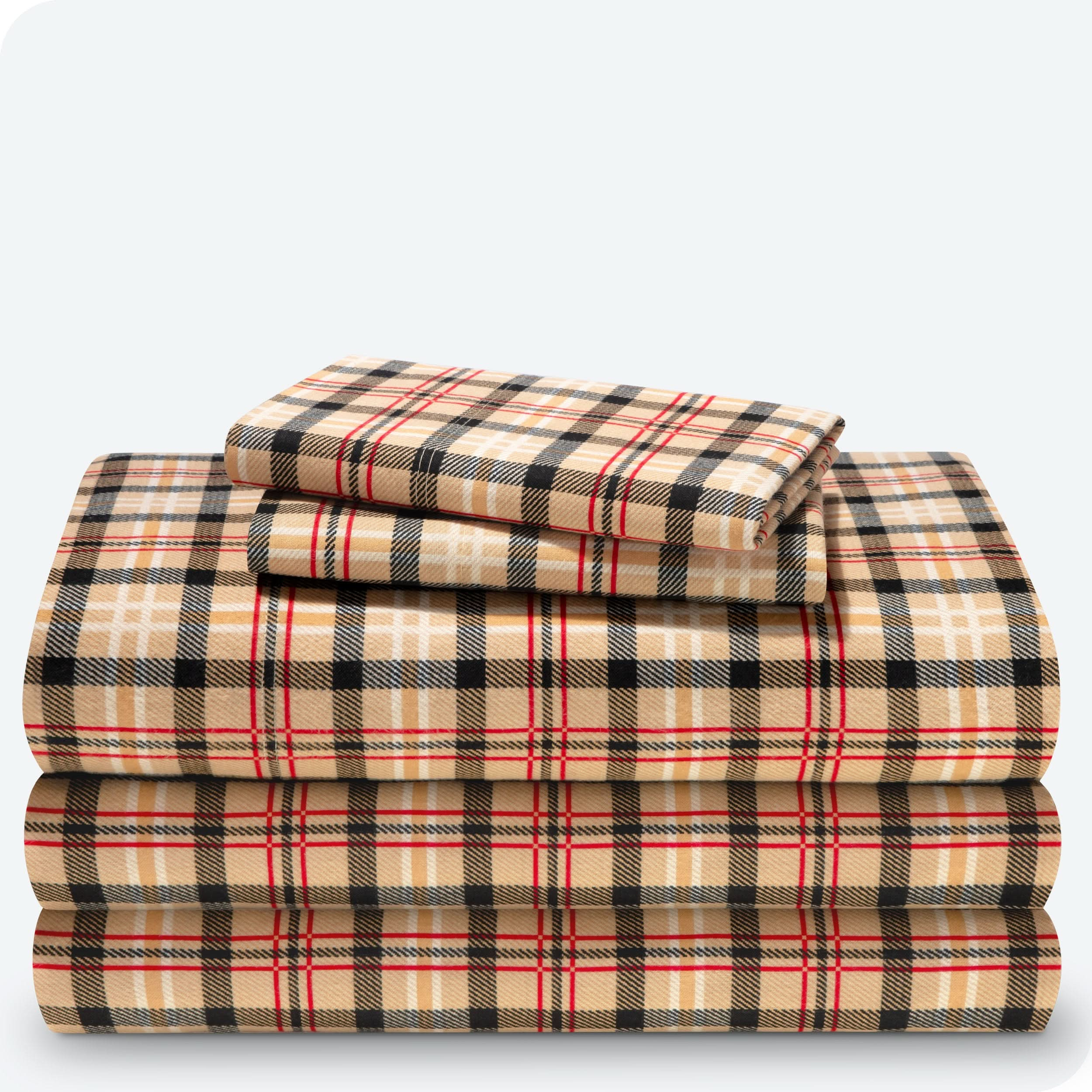 Flannel print sheet set folded and stacked neatly on a white background