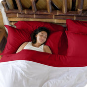 A woman sleeping in a bed made with bamboo sheets