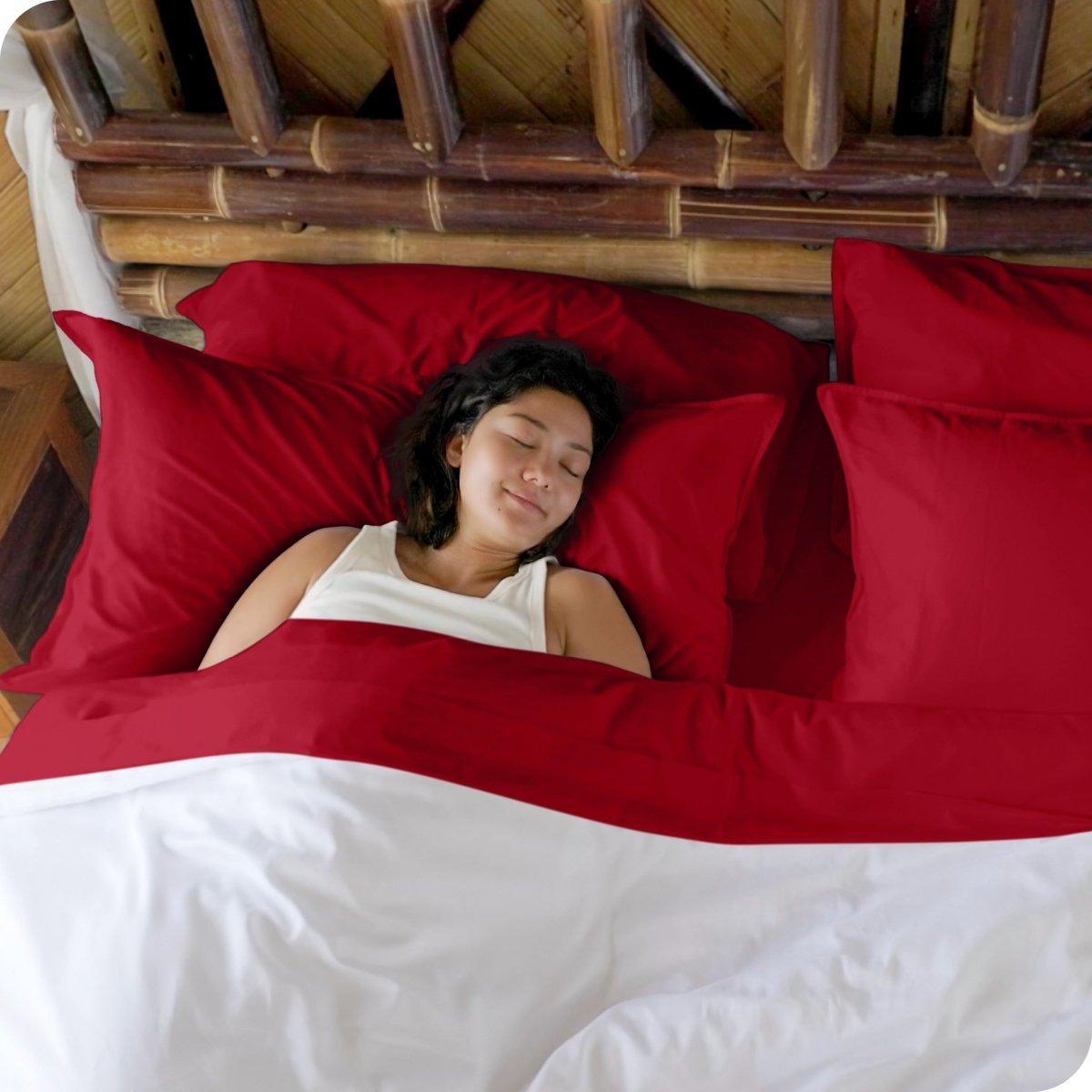 A woman sleeping in a bed made with bamboo sheets