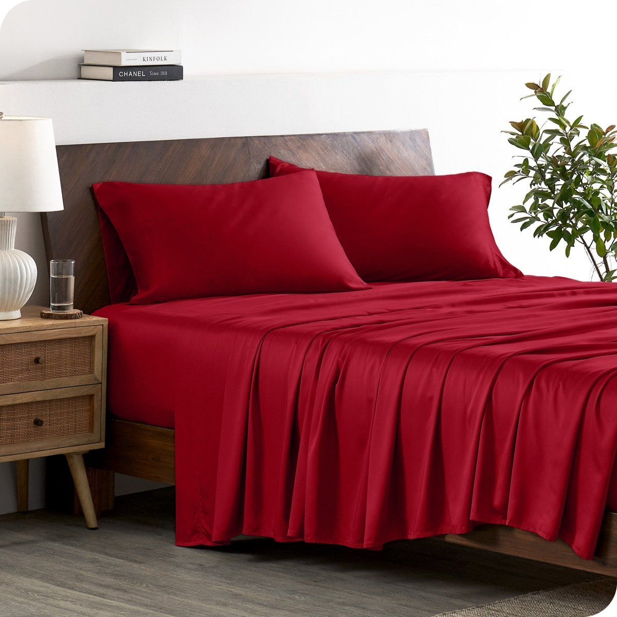 A stylish bed with bamboo sheets and pillowcases, showcasing a sophisticated and elegant bedroom setting.