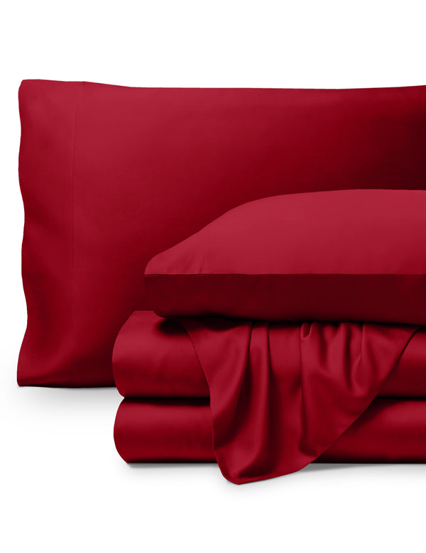 Bamboo pillowcases and sheets set on a white background