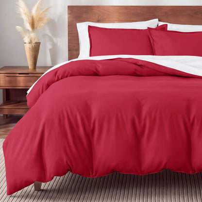 Flannel bedding set on a bed in a bedroom with a nightstand and lamp.