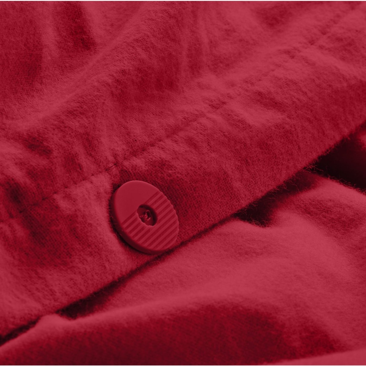 Close up of the button closure on a flannel duvet cover