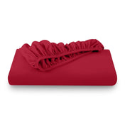A folded flannel cotton fitted sheet in a white background