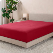 A modern bed with a flannel fitted sheet on