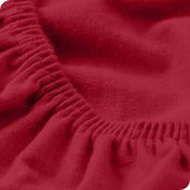 Close up of the elastic portion of a flannel fitted sheet