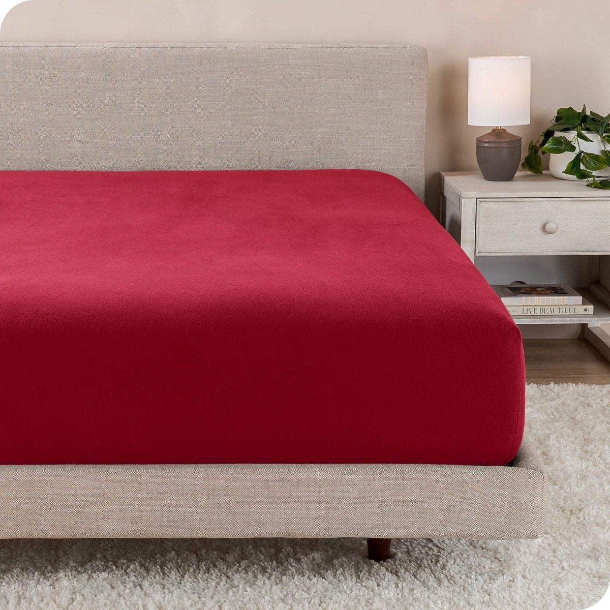 A close up of a modern bed with a flannel fitted sheet on